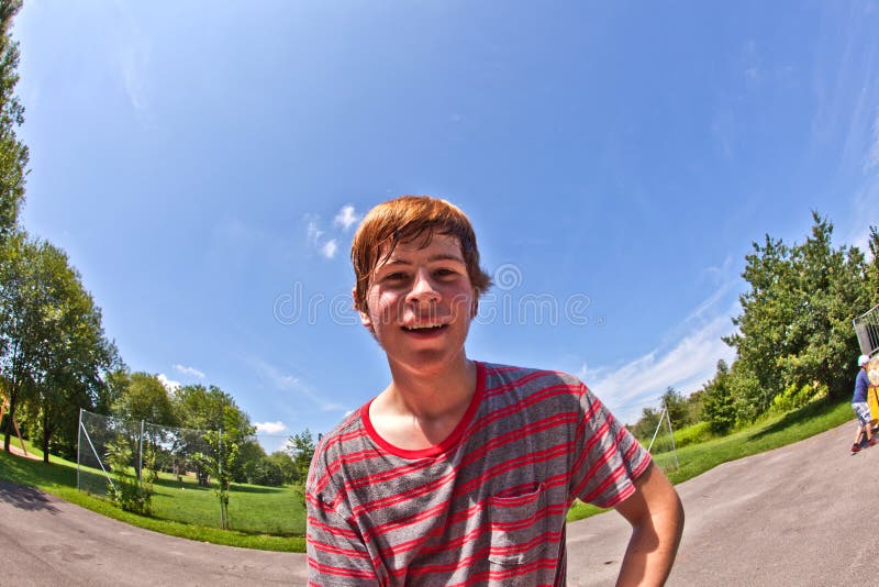 Young happy boy sweating and exhausted from sports