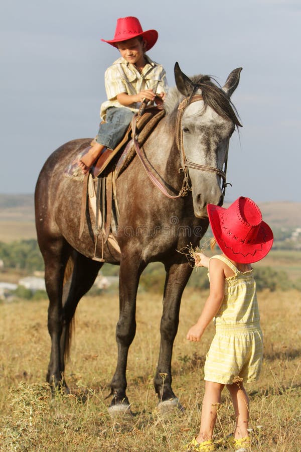 Young Happy Children Riding Horse Stock Image - Image of brother
