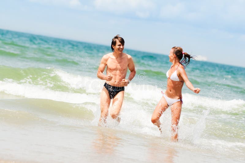 Young happy couple on the beach