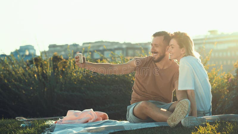 Young happy couple doing selfie