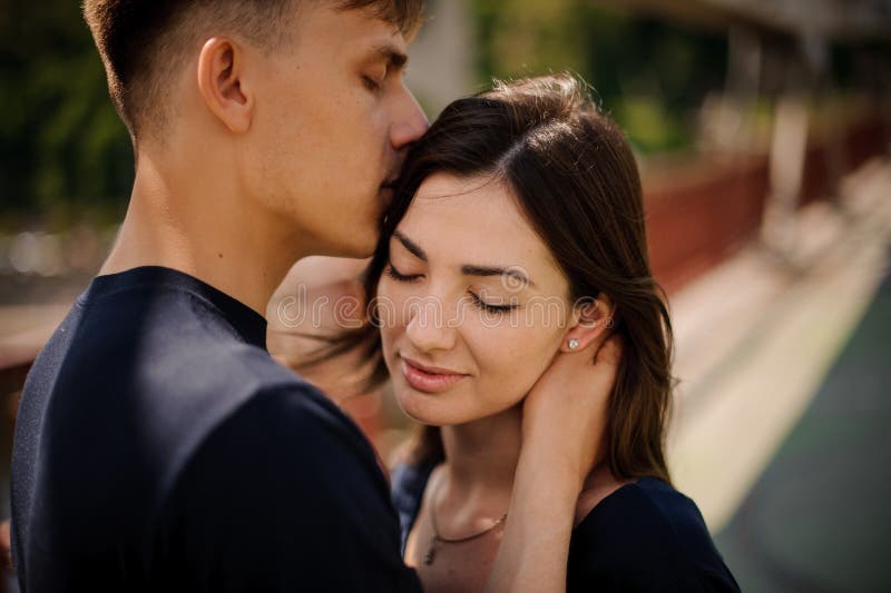 Young Happy Couple in Love in a Romantic Moment of Man Kissing His Wife ...