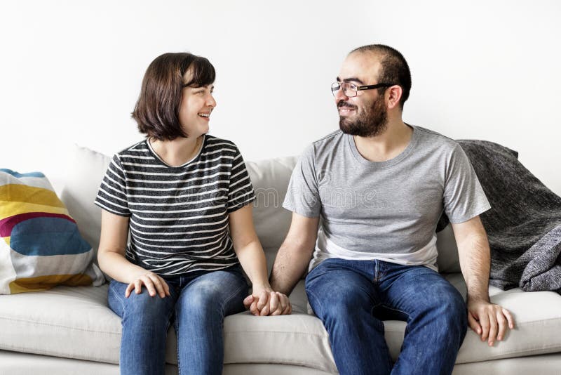 Young happy couple relaxing at home stock images