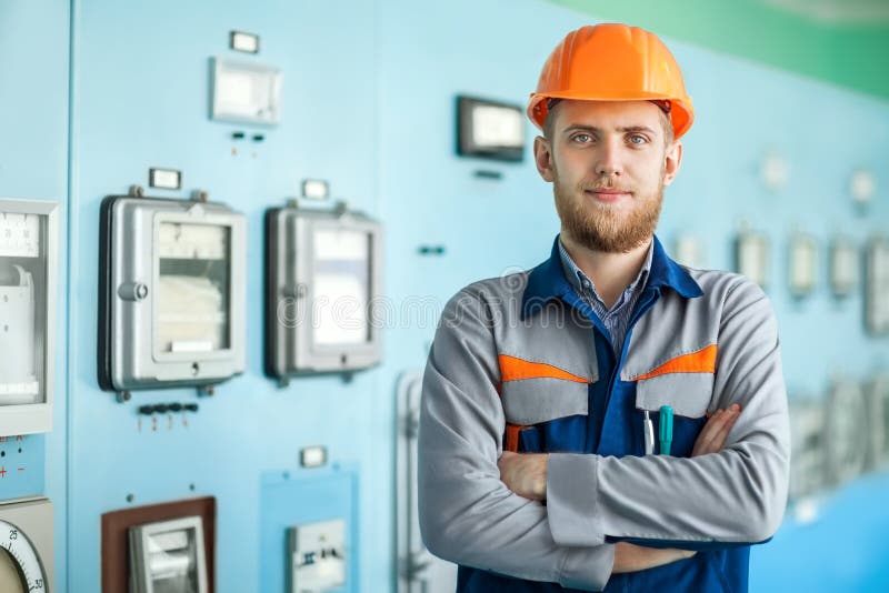 Young happy engineer at control room stock photo