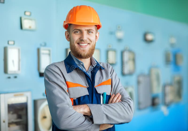 Young happy engineer at control room stock images