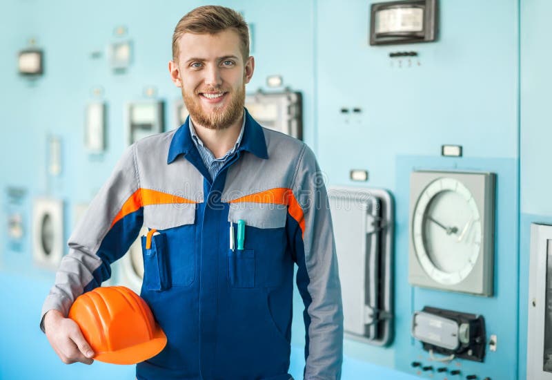 Young happy engineer in control room royalty free stock images