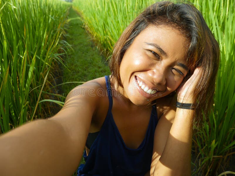 Natural And Fresh Portrait Of Young Happy And Exotic Islander Asian 