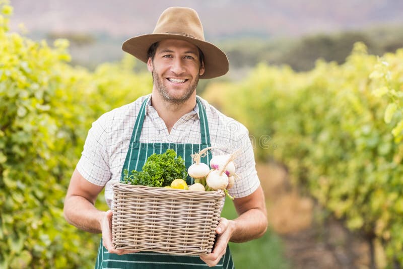 Young Farmers With Harvest Of Beetroots In Field Stock Photo