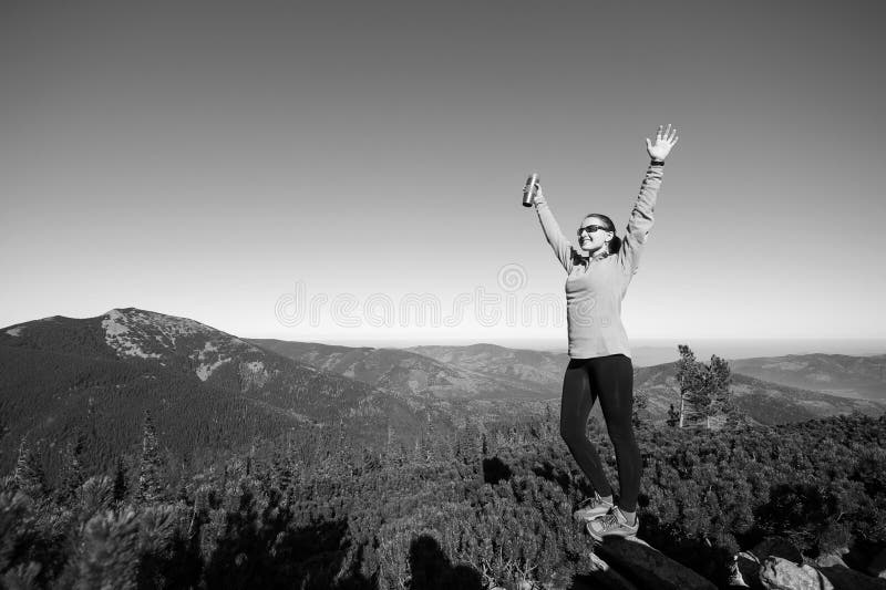 Young happy female hiker at the mountain top royalty free stock images Young happy female hiker at the mountain top royalty free stock images