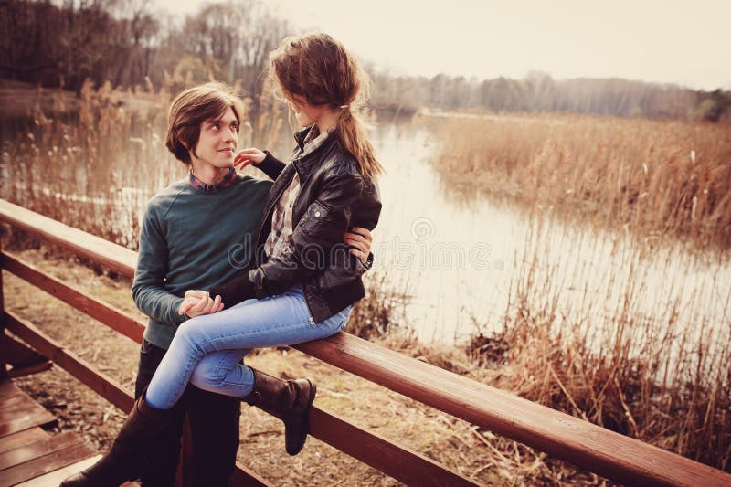 Young happy loving couple having fun on the walk in early spring