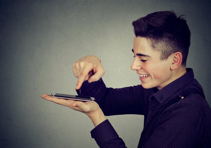 Young happy man using smartphone royalty free stock photos Young happy man using smartphone royalty free stock photos