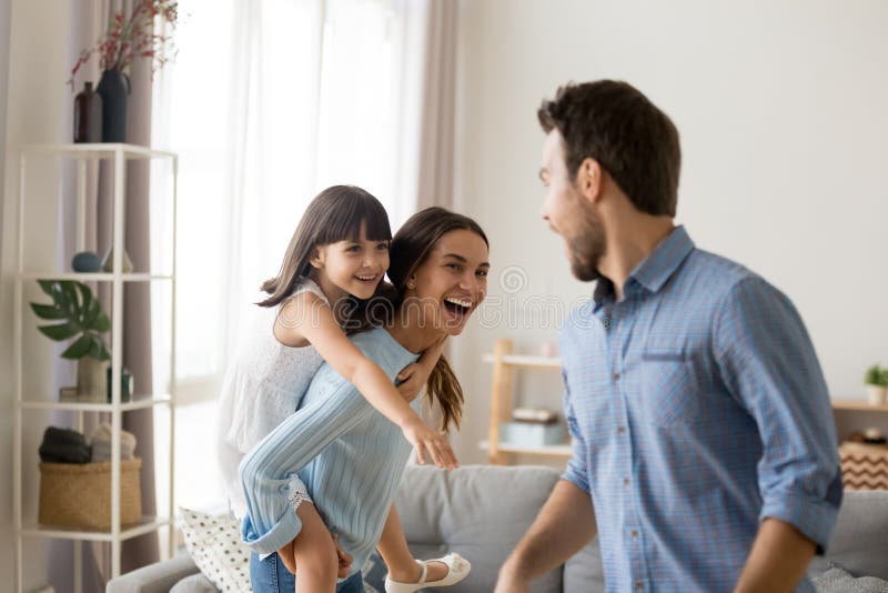 Diverse family playing at home having active weekends together