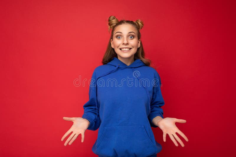 Young happy positive delightful attractive blond lady with two horns with sincere emotions wearing stylish bright blue