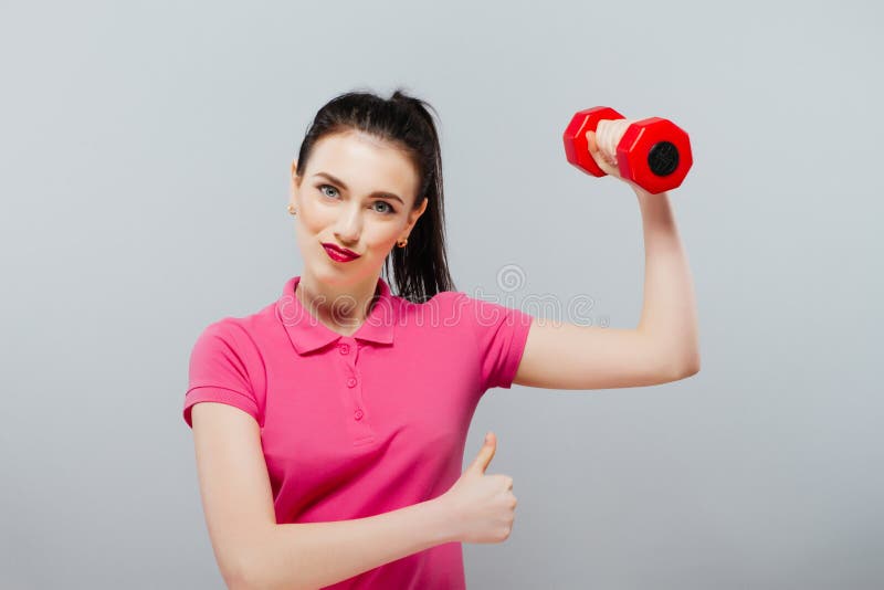 Young happy smiling woman in sportswear. Girl is pretty and fashion. good resaults royalty free stock photos Young happy smiling woman in sportswear. Girl is pretty and fashion. good resaults royalty free stock photos