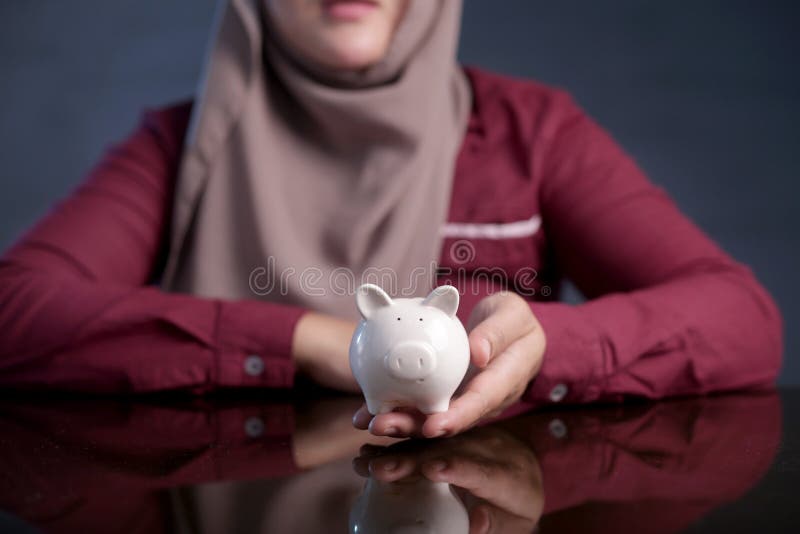 Muslim Woman with Piggy Bank, Saving Investment Concept