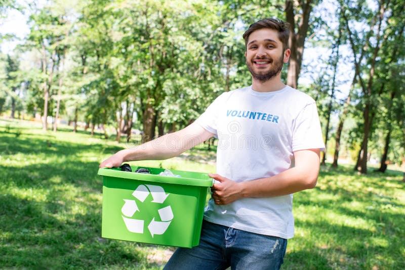 young happy volunteer holding recycling box stock image young happy volunteer holding recycling box stock image