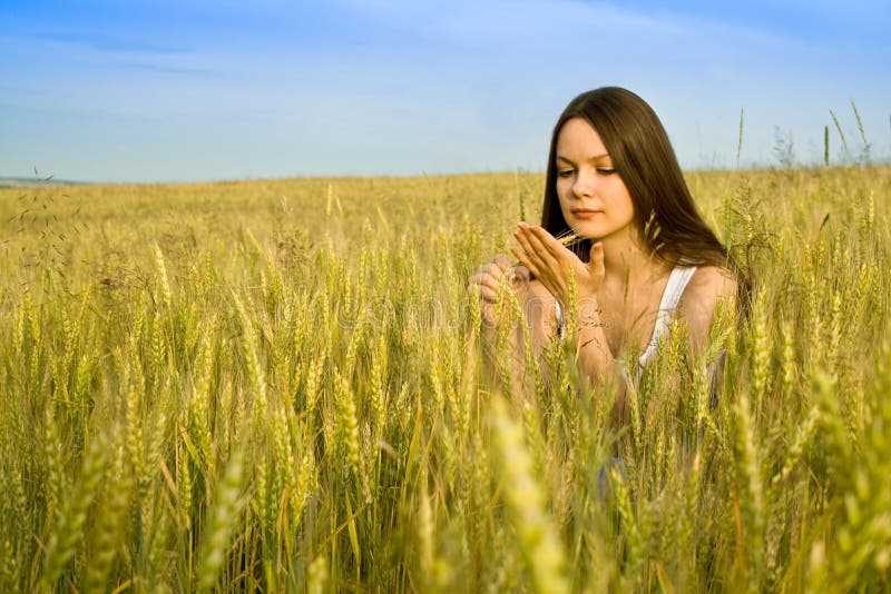 Young happy woman in field