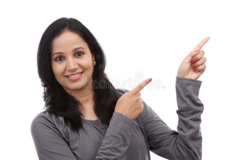 Young happy woman showing copyspace royalty free stock photography
