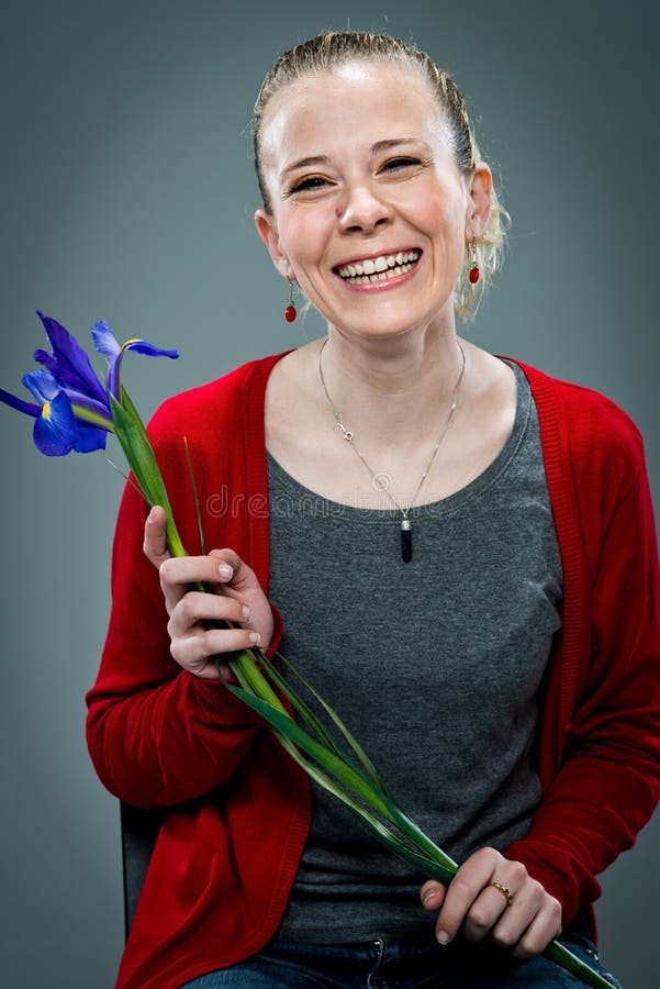 https://thumbs.dreamstime.com/b/young-happy-woman-smiling-violet-flower-over-grey-background-30073793.jpg