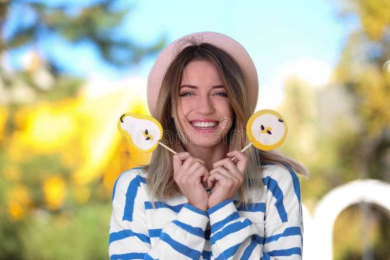 Young happy woman with sweet candies stock photos Young happy woman with sweet candies stock photos