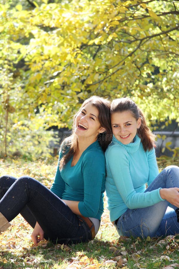 Young happy women on natural autumn background