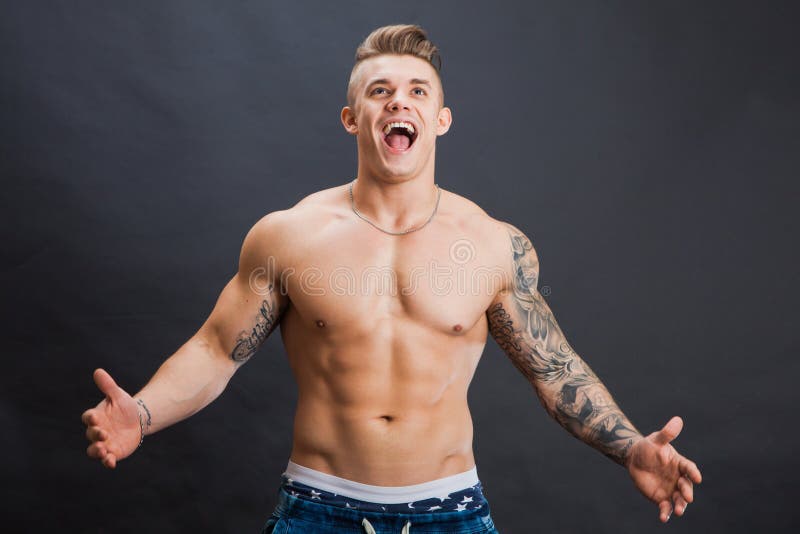 Young and healthy man topless laugh and cry