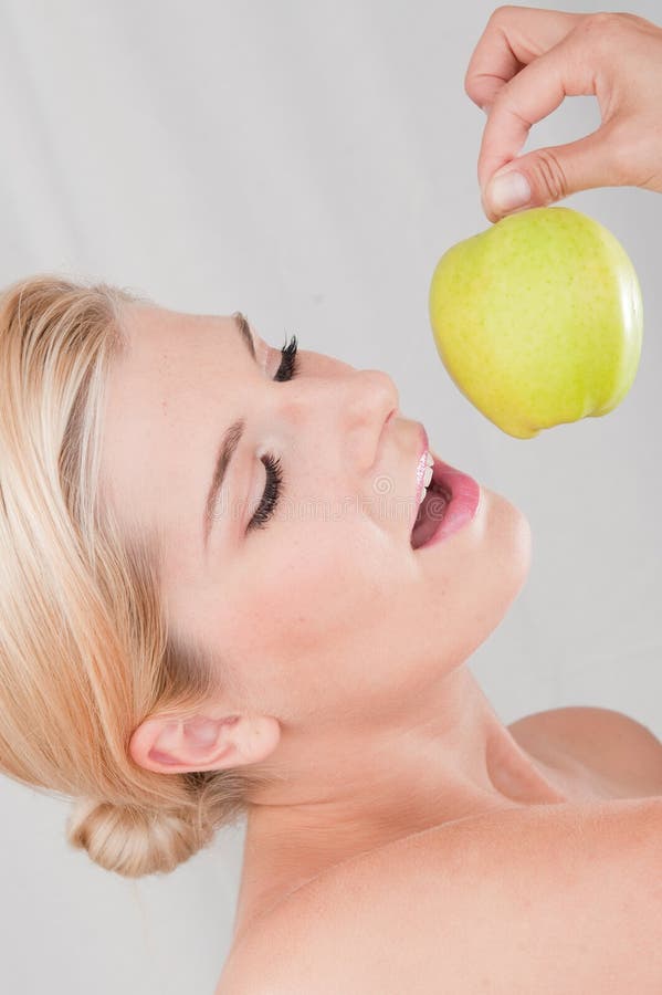 Young healthy woman with apple