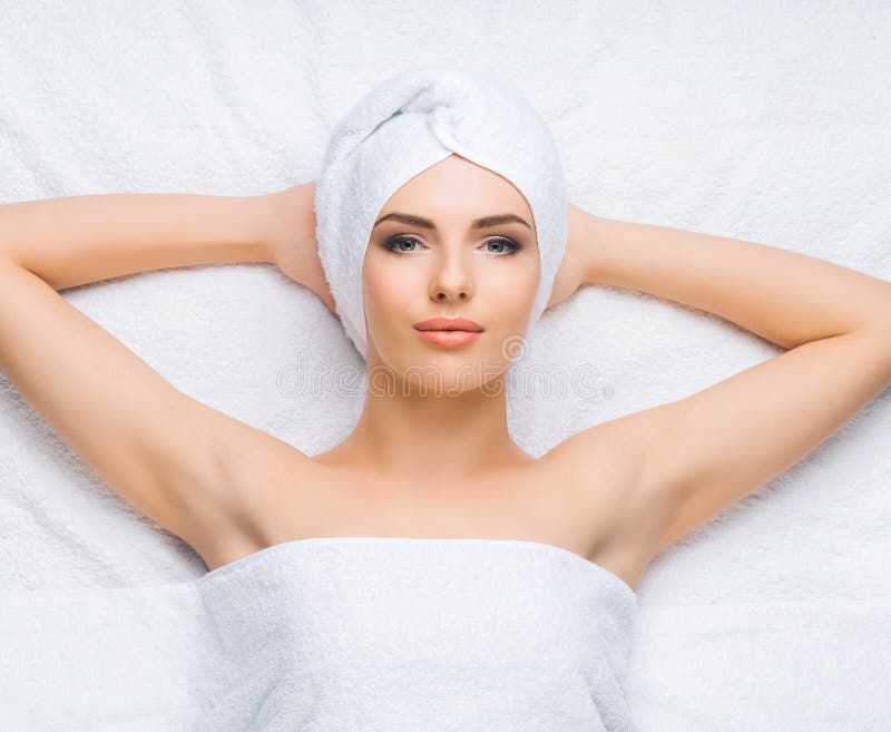 Young And Healthy Woman Gets Massage Treatments For Face Skin And Neck