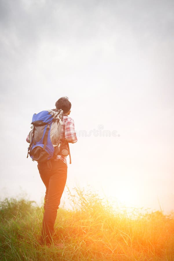 Young hipster man outdoor with backpack on his shoulder, Time to. Vacations, space.