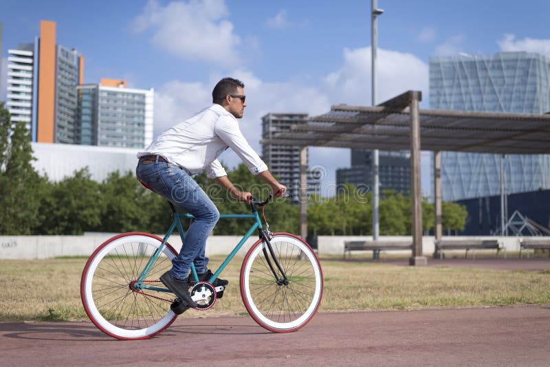 Young Hipster Man Riding Fixed Gear Bike on City Street Stock Photo - Image  of fixed, businessman: 252597902