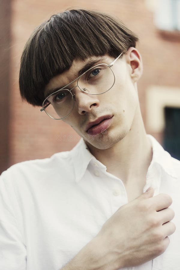 Young Hipster Man in Street Style Fashion Concept. the Guy is Wearing a  White Shirt Wearing Stylish Glasses Stock Image - Image of lifestyle,  caucasian: 149786699