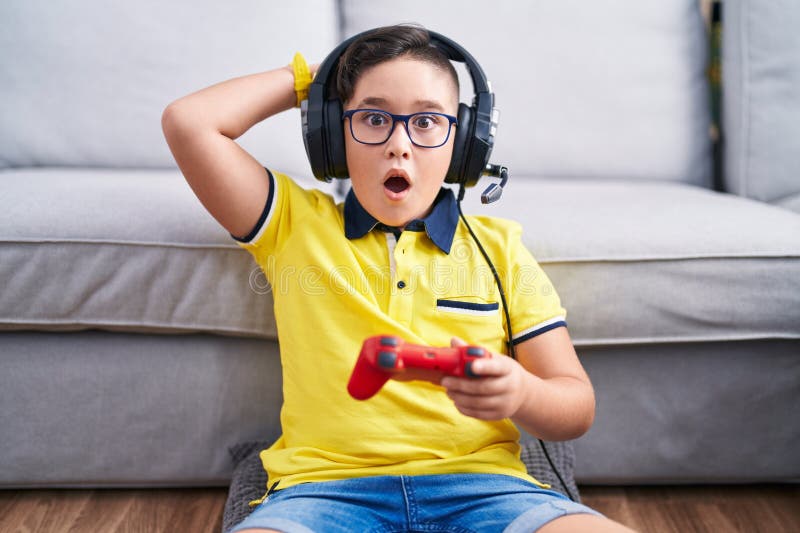 Smiling young child with video game controller Royalty-Free Stock Image -  Storyblocks