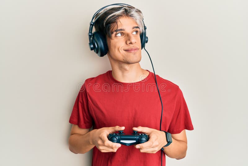 Person playing video games with controller on computer. Player using  joystick and wearing headphones to play online game on monitor. Modern man  using gaming equipment to have fun Stock Photo - Alamy