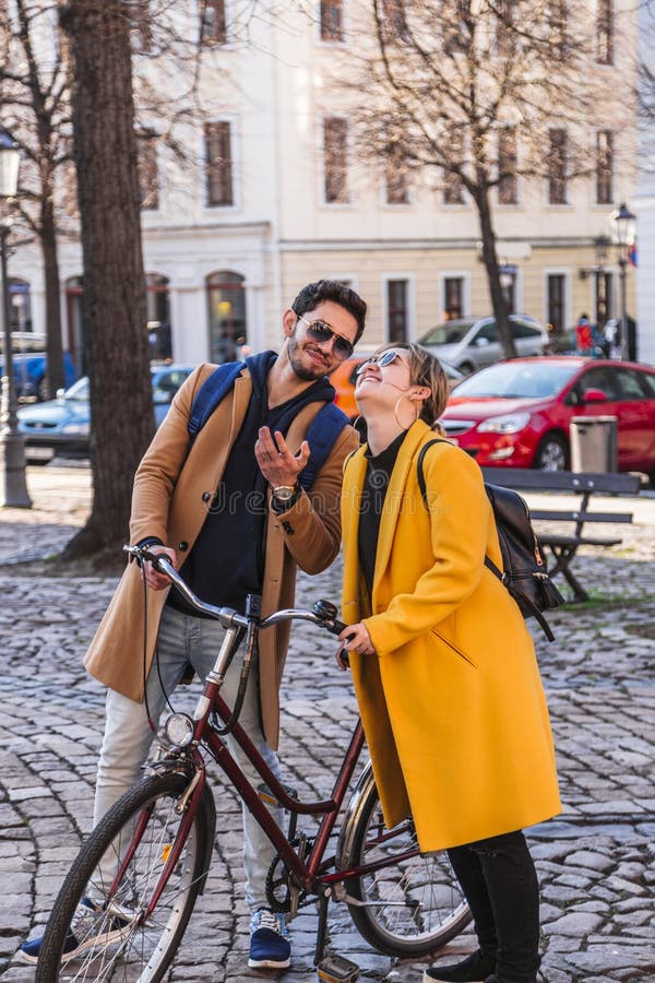 Young hispanic man tells something funny to girl royalty free stock photos Young hispanic man tells something funny to girl royalty free stock photos