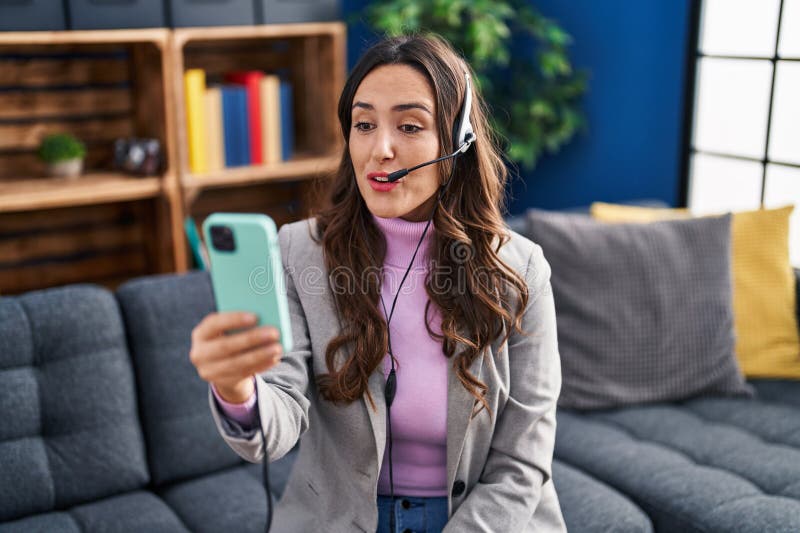 Young Hispanic Woman Call Center Agent Working Sitting on Sofa at Home