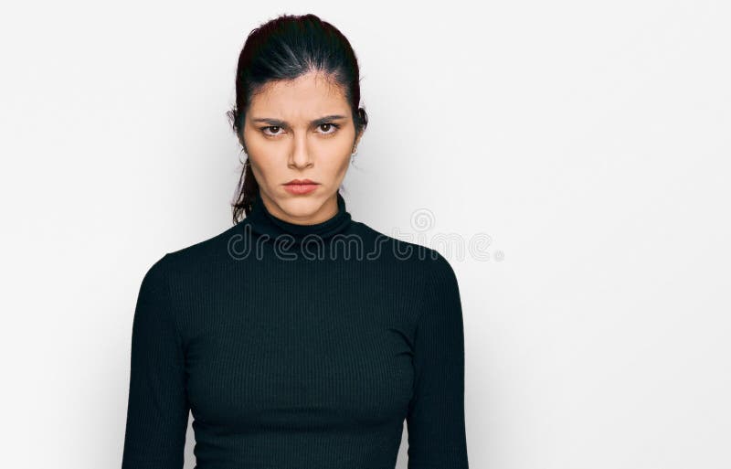 Young hispanic woman wearing casual clothes skeptic and nervous, frowning upset because of problem