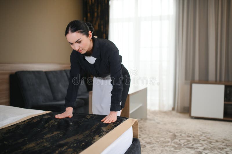 Young Hotel Maid Making the Bed Stock Image - Image of room, black: 335020855