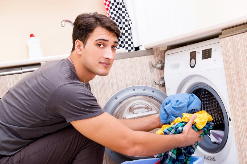 The Young Husband Man Doing Laundry at Home Stock Photo - Image of ...