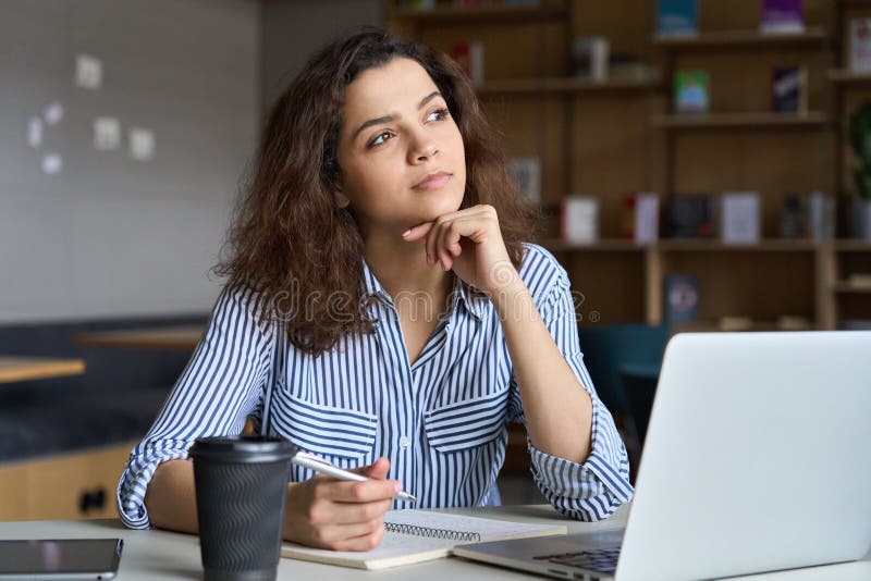 Young latin indian student using laptop learning online in virtual class. royalty free stock photography