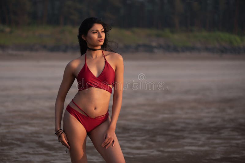 [Image: young-indian-girl-red-bikini-enjoying-he...707472.jpg]