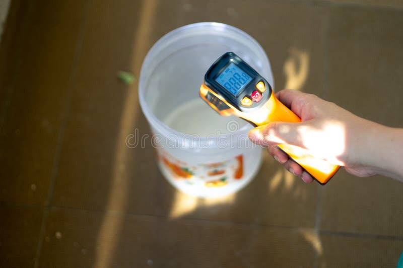 https://thumbs.dreamstime.com/b/young-indian-girl-taking-temperature-compound-plastic-jar-infrared-thermometer-soap-making-young-indian-155731858.jpg