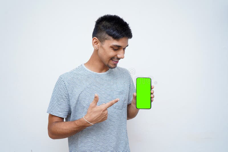 Young Indian Handsome Boy Pointing His Finger Towards His Mobile with ...