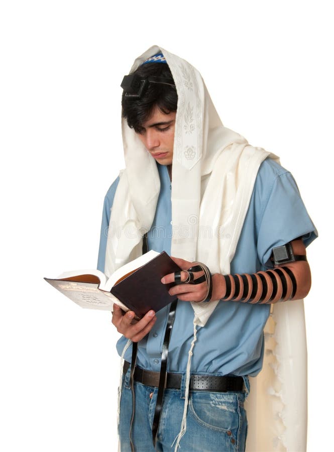 A young boy wearring his phylacteries (Tefillin), for the …