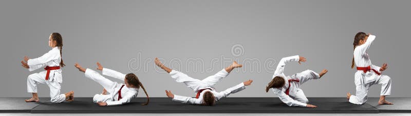 Young judo caucasian female fighter in white kimono with red belt in motion and action during training. Practicing