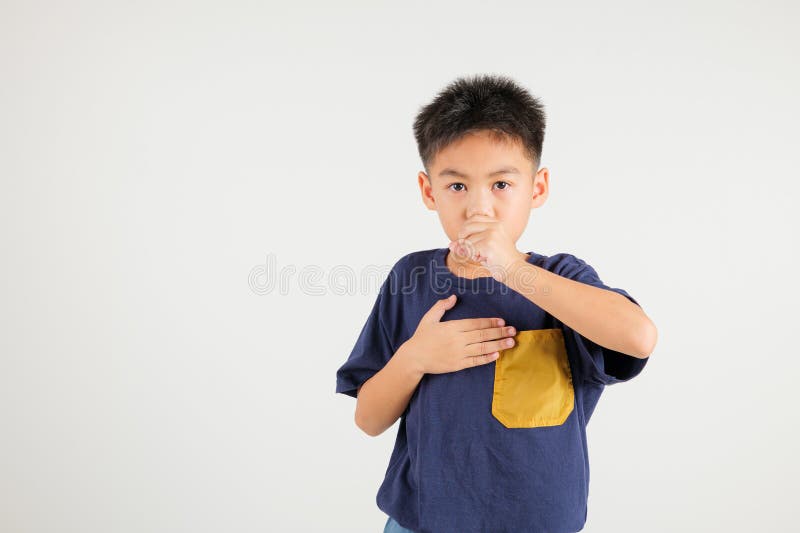 Young kid boy pressing on chest pain isolated on white background, painful royalty free stock photo