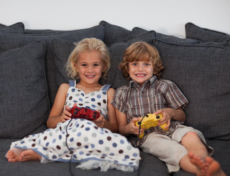 Young People Playing Video Games At Home Stock Photo, Picture and Royalty  Free Image. Image 113583143.