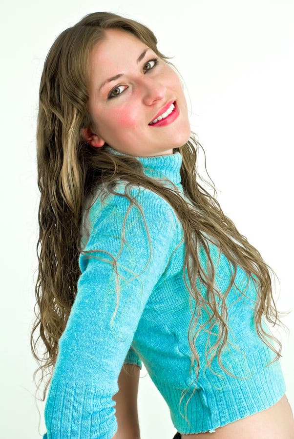 Young lady in blue smiling to camera