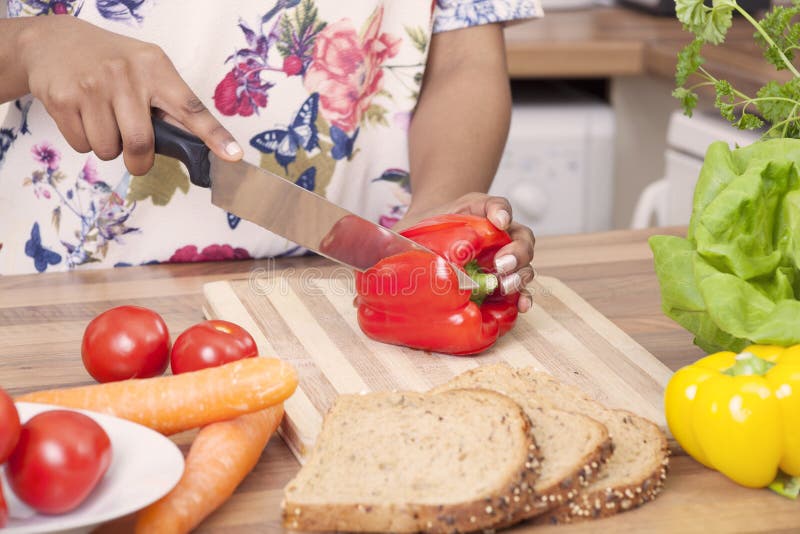 Young lady chopping vegetables royalty free stock images Young lady chopping vegetables royalty free stock images