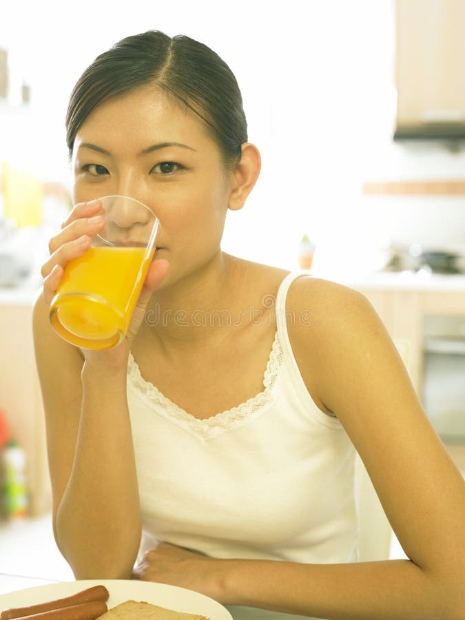 Young Lady Drinking Her Orange Juice Stock Image Image of kitchen
