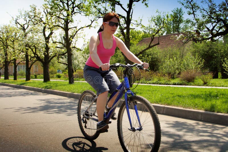 Young lady driving a bicycle