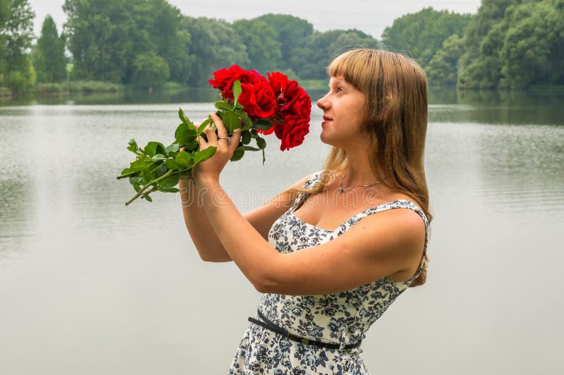 Lady Of The Lake A Red Long Stem Rose Flower Floating On The Surface Of